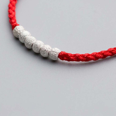 Combo 2 vòng thắt dây đỏ charm bạc - Ngọc Quý Gemstones